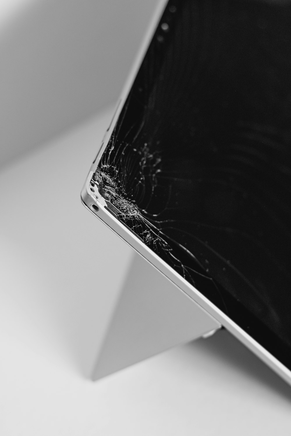 white smartphone on white table