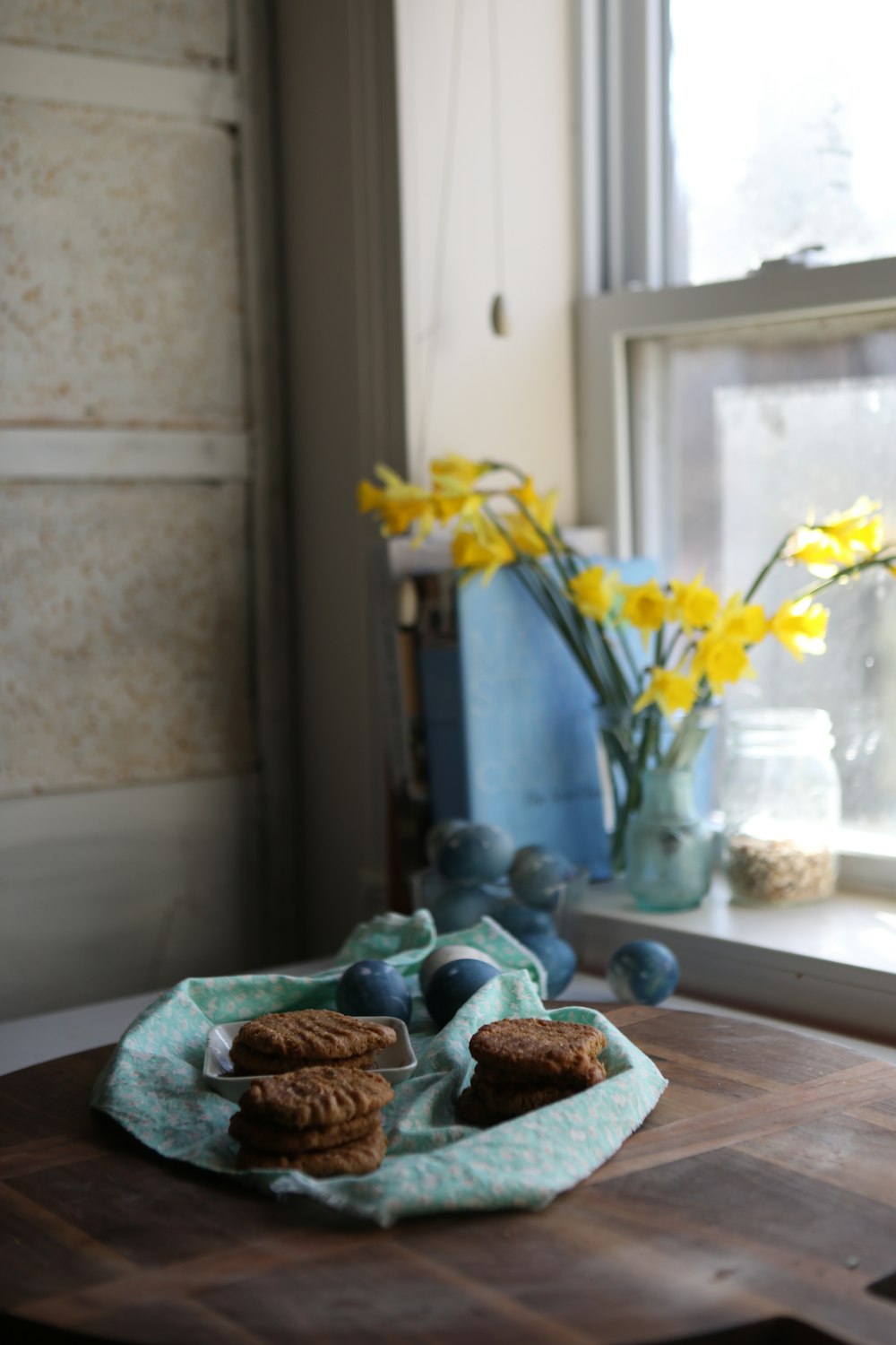 yellow flower on brown wooden table