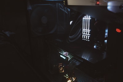 Close-up of hands carefully installing computer components inside a sleek case.