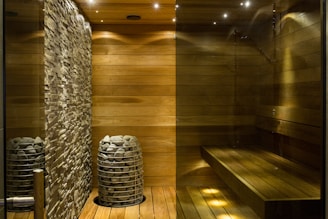 brown wooden round table near gray concrete wall