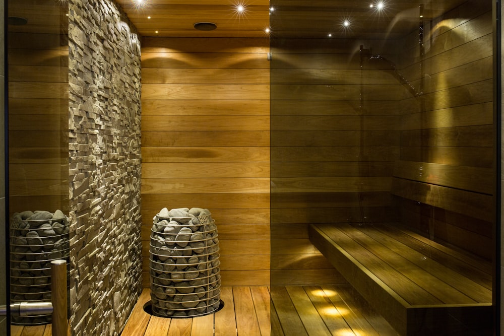 brown wooden round table near gray concrete wall