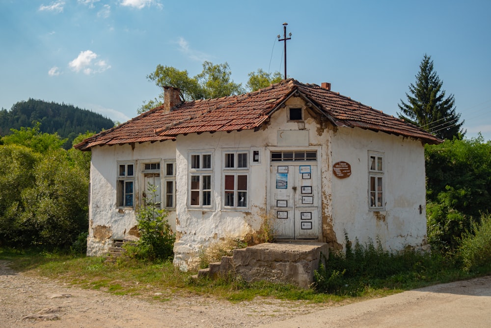 white and brown concrete house under blue sky during daytime