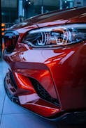 red car in a parking lot