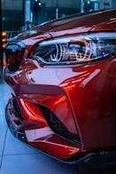 red car in a parking lot