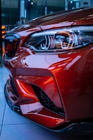red car in a parking lot
