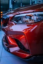 red car in a parking lot