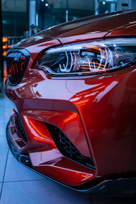 red car in a parking lot