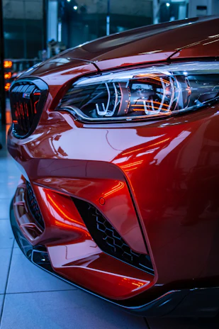 red car in a parking lot