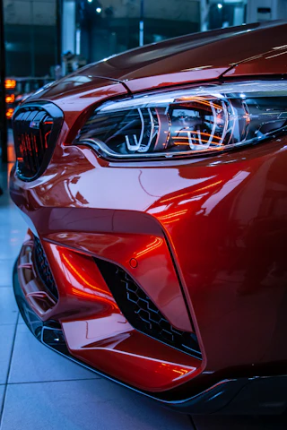 red car in a parking lot