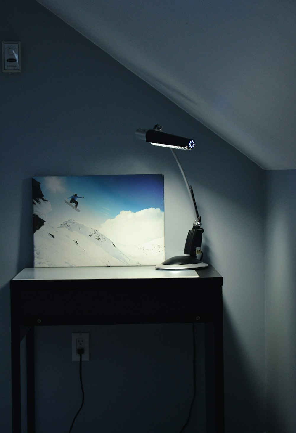 Black Flat Screen Tv Mounted On White Wall Photo Free Display