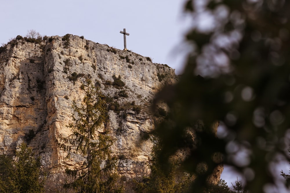 person standing on rock formation during daytime