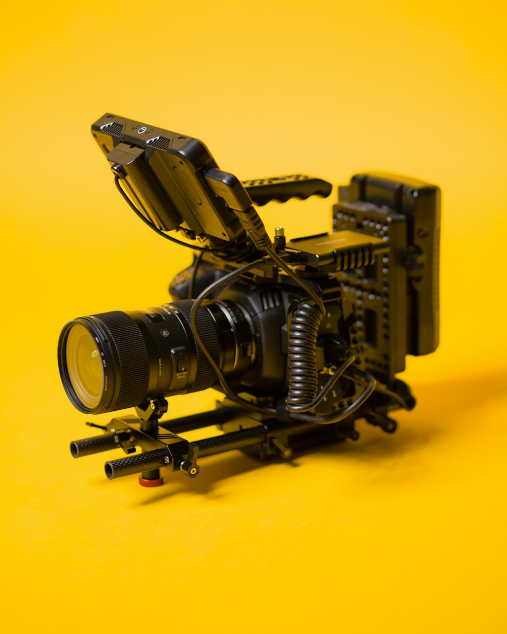 black camera on yellow surface
