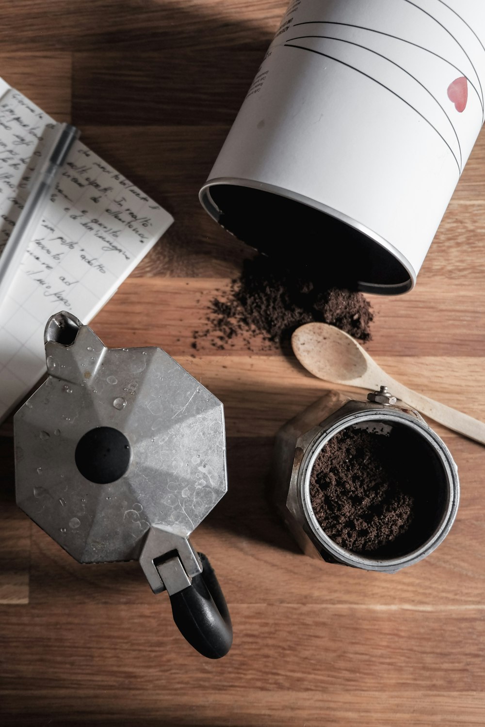 black and silver coffee pot on brown wooden table