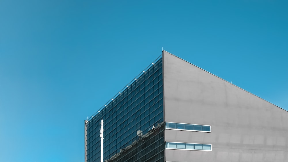 white and black concrete building under blue sky during daytime