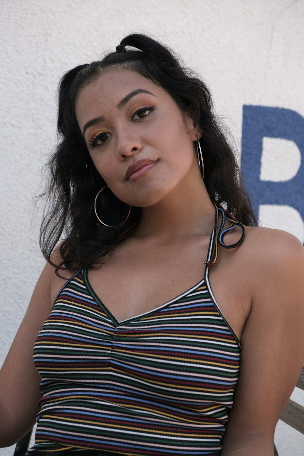 woman in blue and white striped halter top