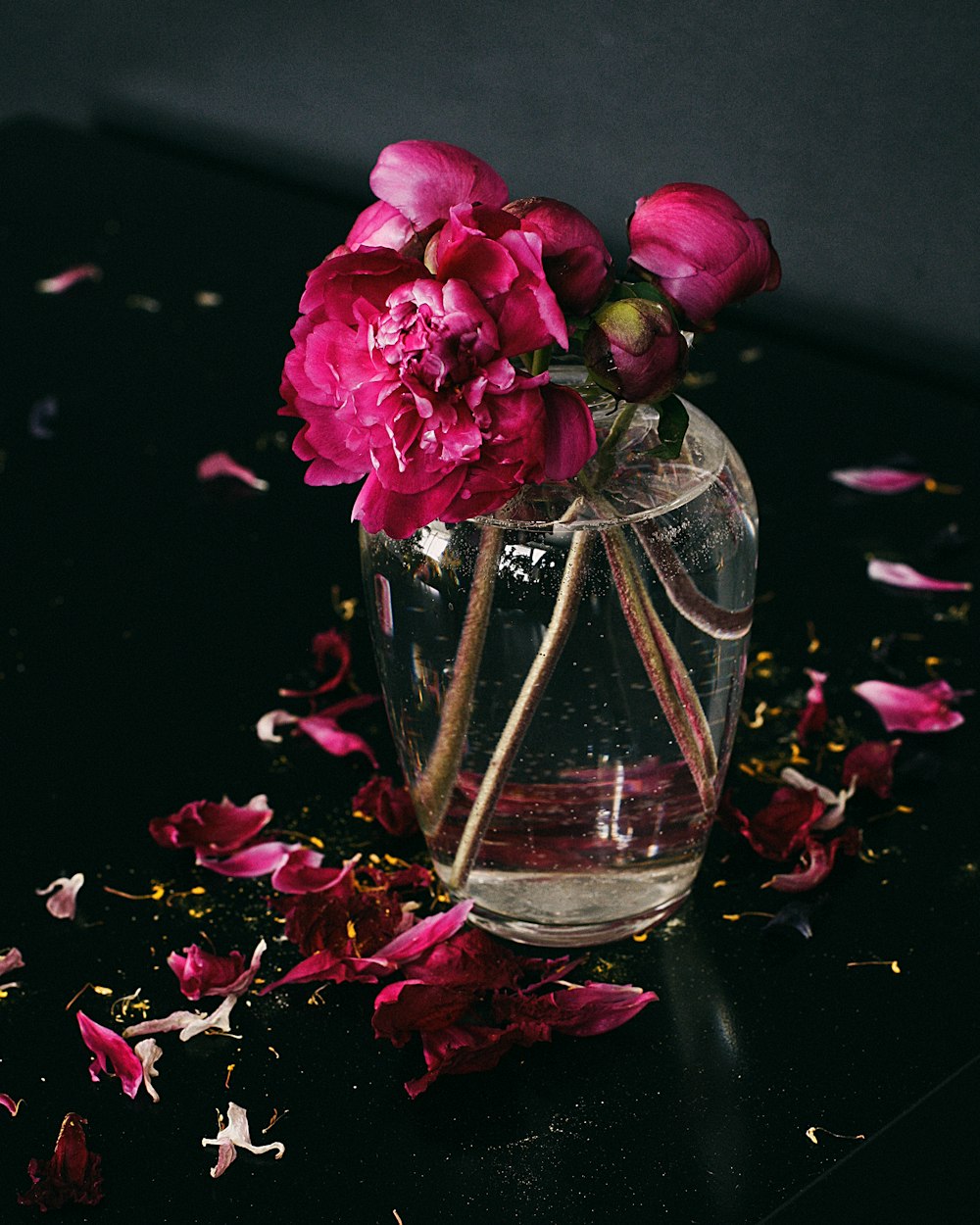 pink flowers in clear glass vase