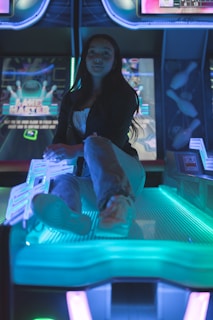 Beta testers engaging with the Proyecto Hermes game on tablets, surrounded by glowing blue and orange neon lights.