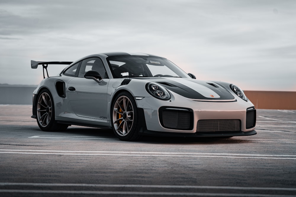 black porsche 911 on gray asphalt road