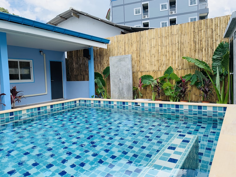 swimming pool near brown brick wall