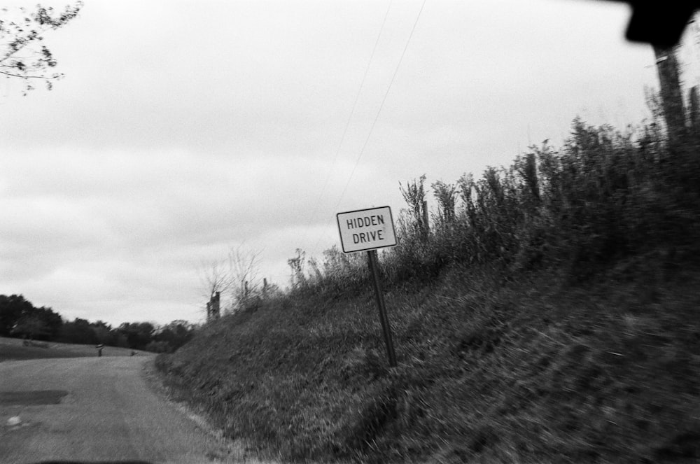 grayscale photo of stop road sign