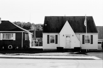 grayscale photo of 2 storey house