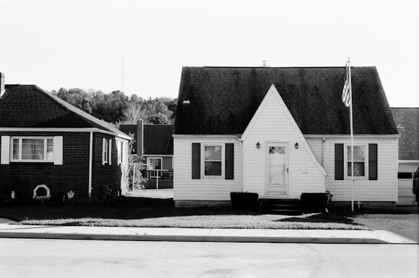 grayscale photo of 2 storey house