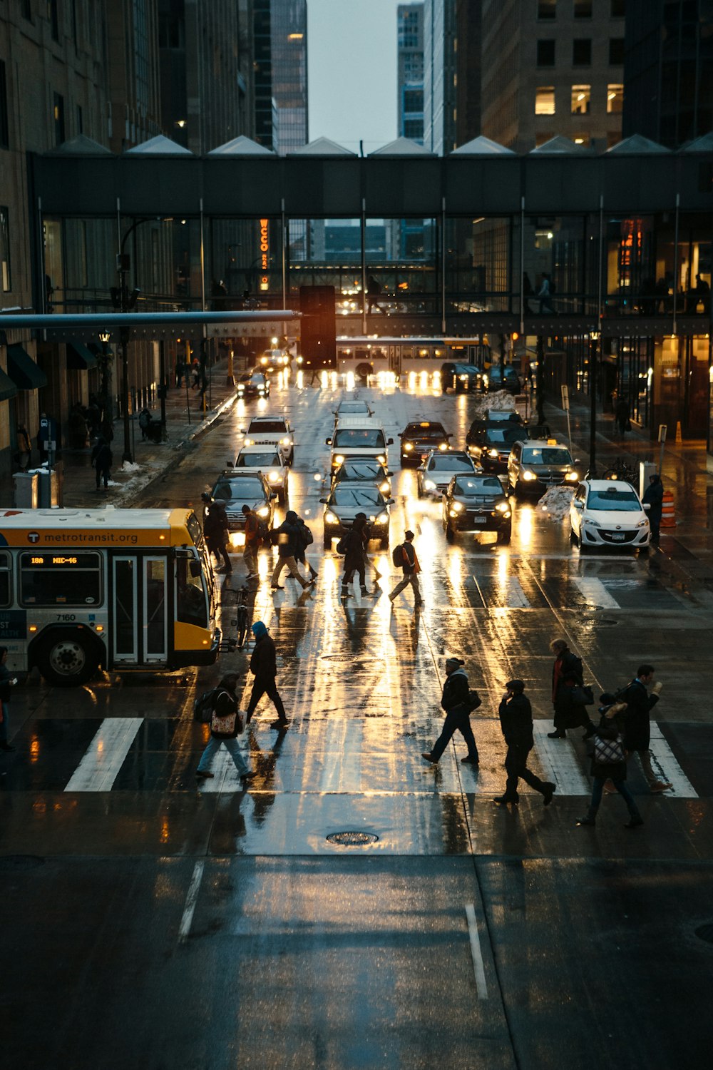 people walking on pedestrian lane during night time