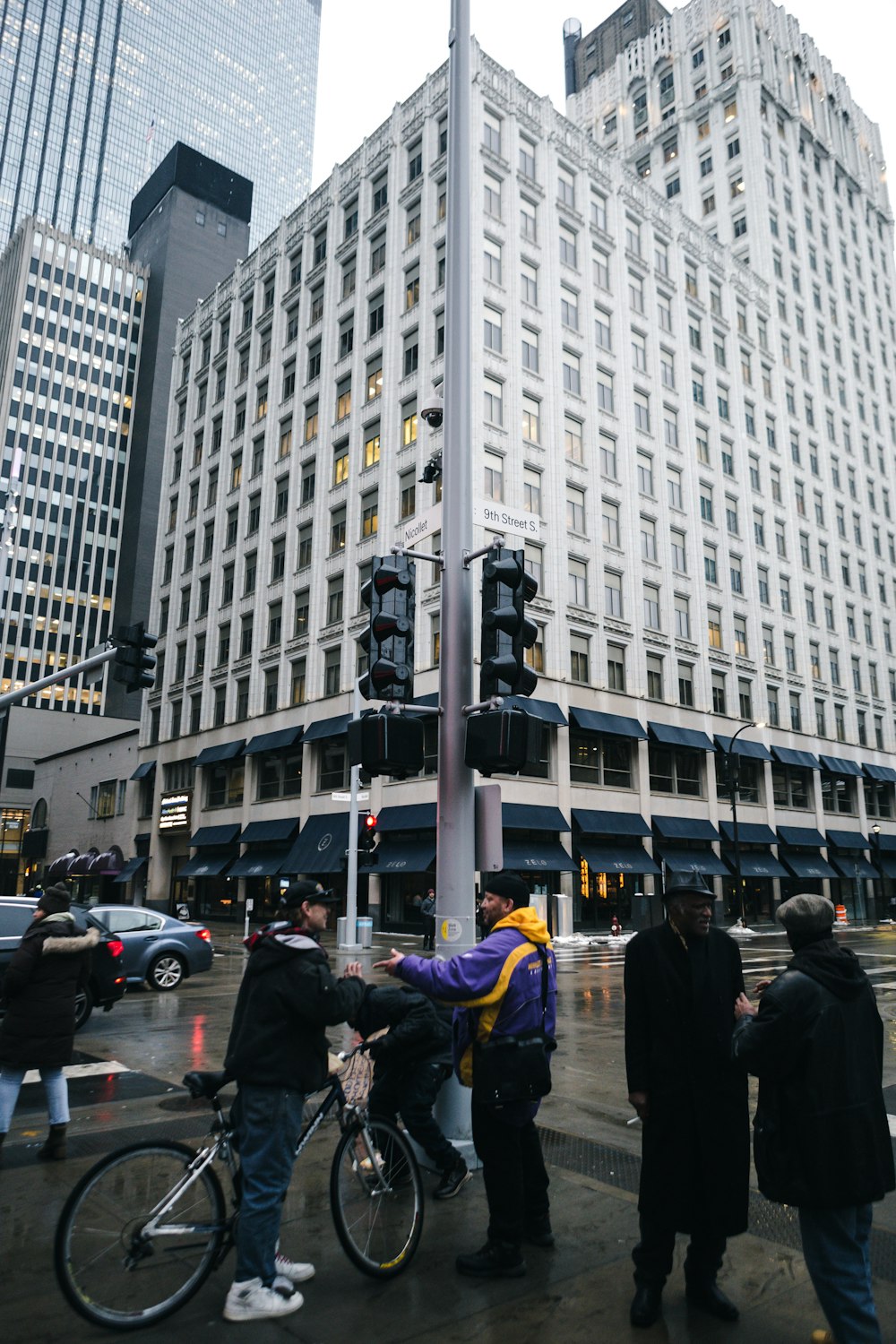 people walking on pedestrian lane near white concrete building during daytime