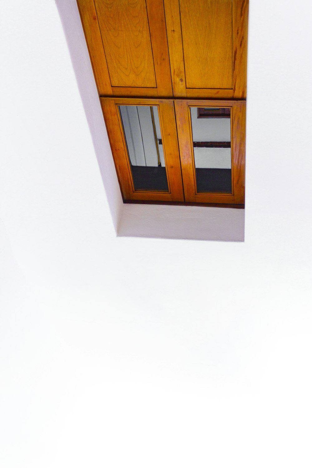 brown wooden framed glass window