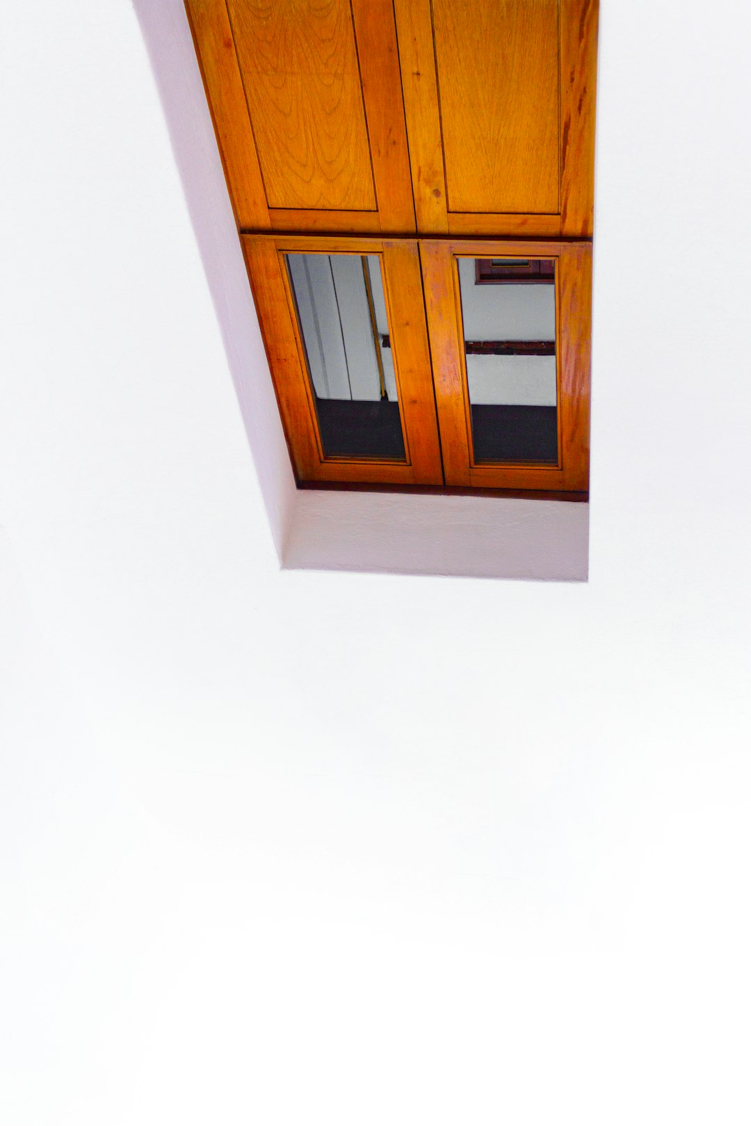 brown wooden framed glass window