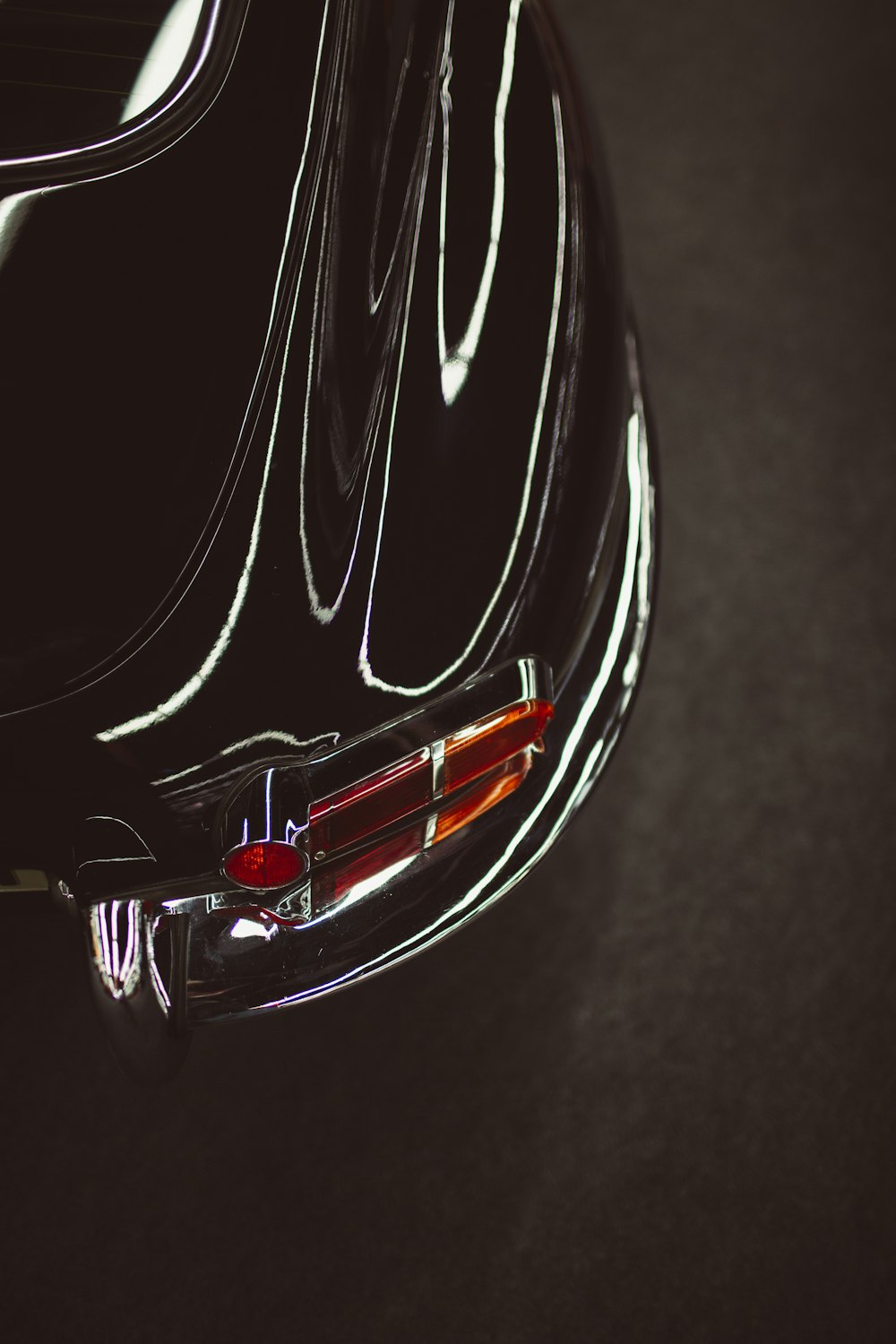 red and black car in close up photography