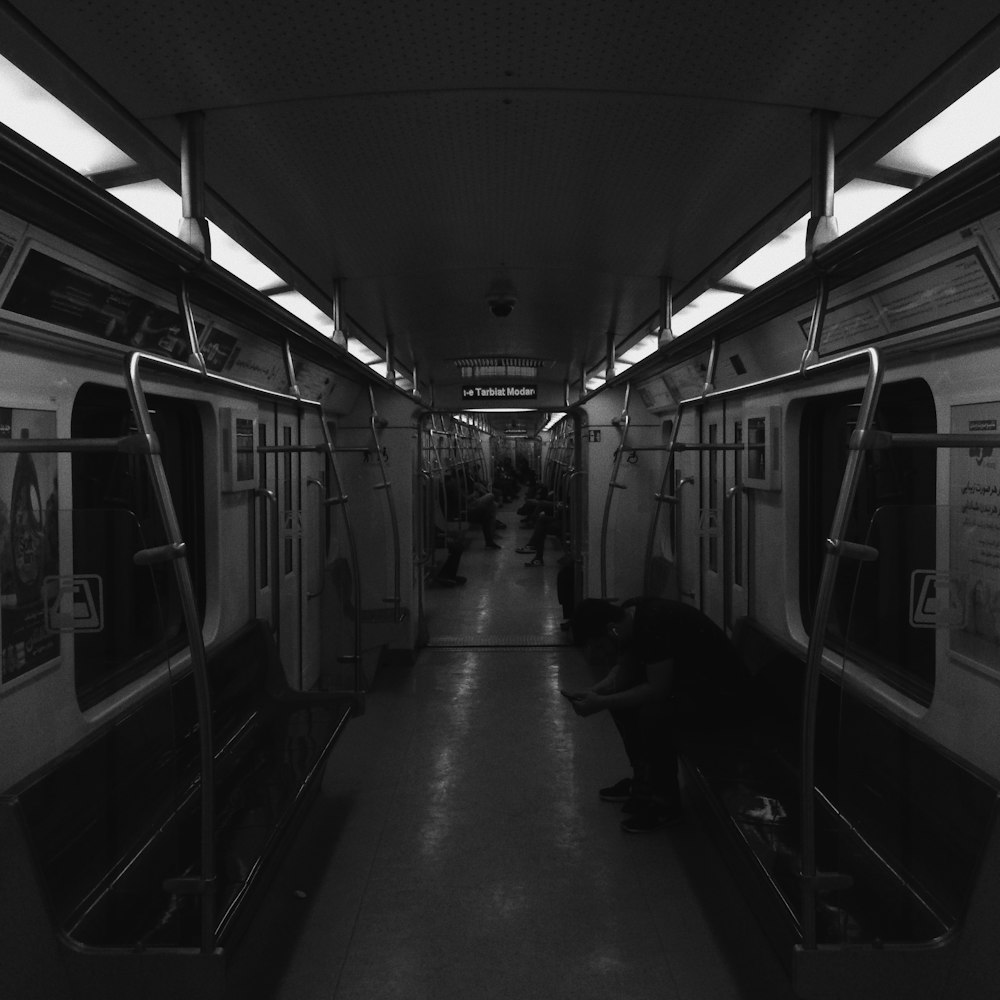 grayscale photo of train in train station