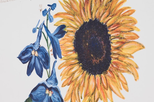 Close-up of a tiny painting showing intricate details of a blooming sunflower.