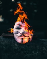 blue and purple flame on black surface