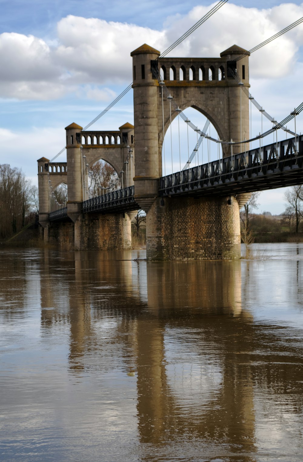 brown bridge over river during daytime