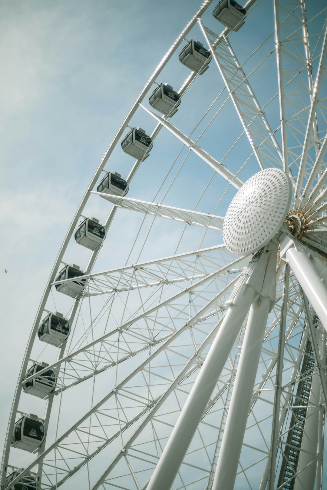 white ferris wheel under blue sky during daytime