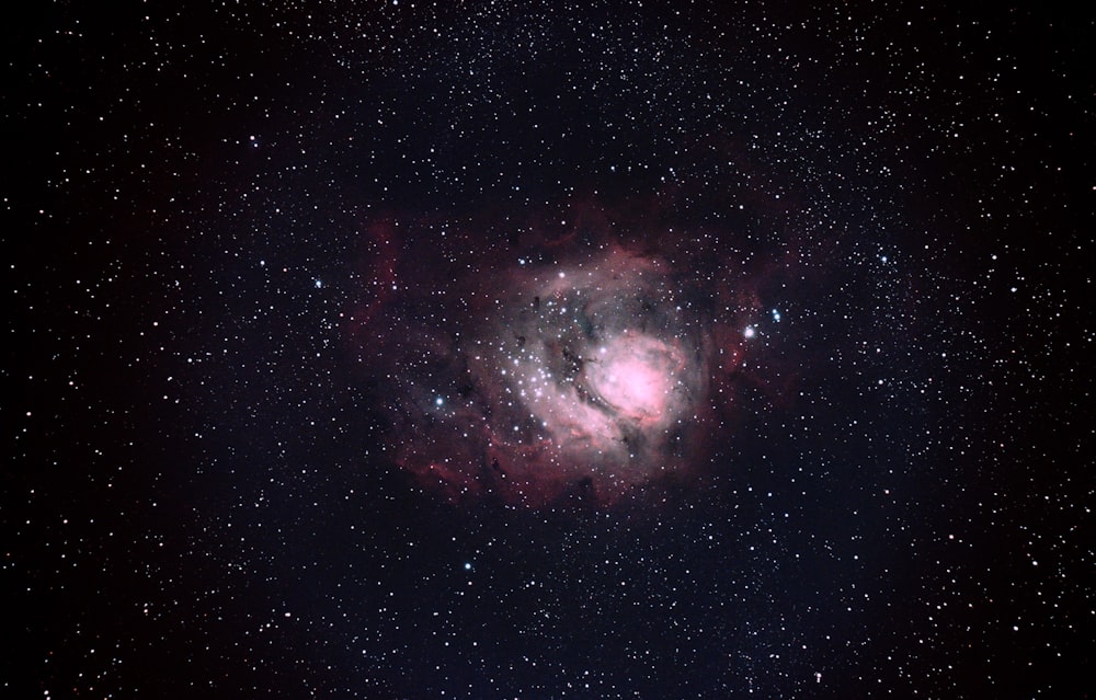 black and red galaxy with stars