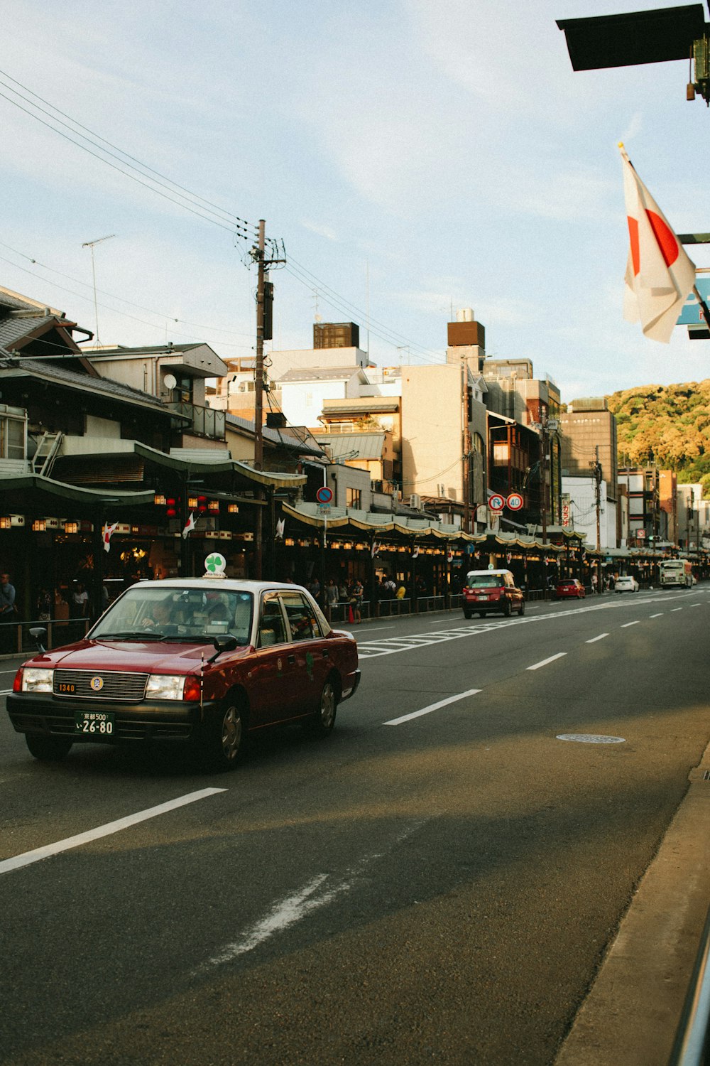 red car on road during daytime