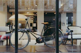 A minimalist showroom display featuring various stylish bikes under soft lighting.