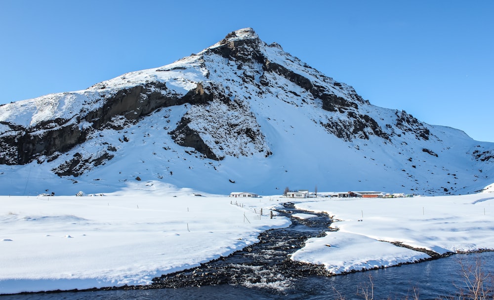 snow covered mountain during daytime