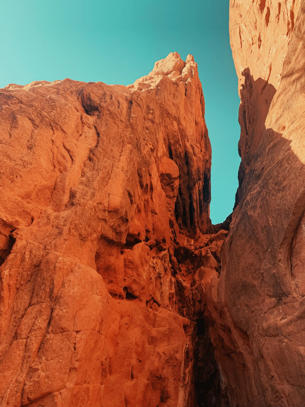 brown rock formation under blue sky during daytime