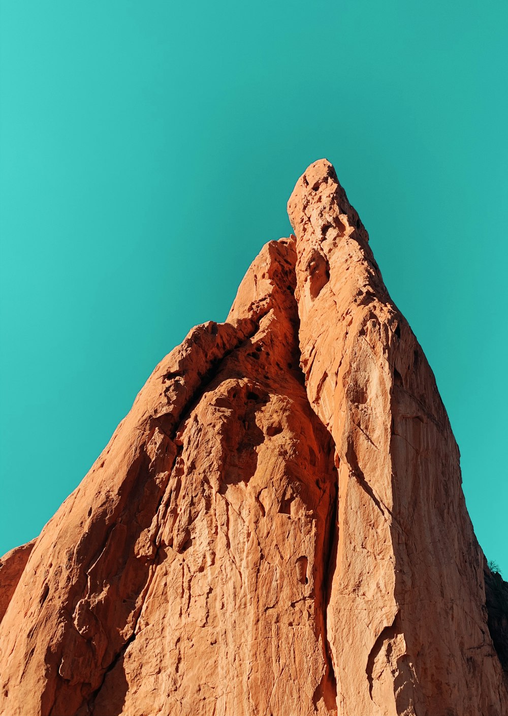 brown rock formation under blue sky during daytime