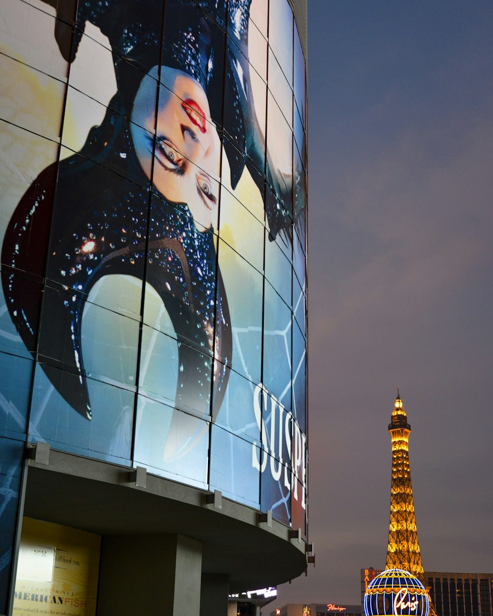 womans face on glass building