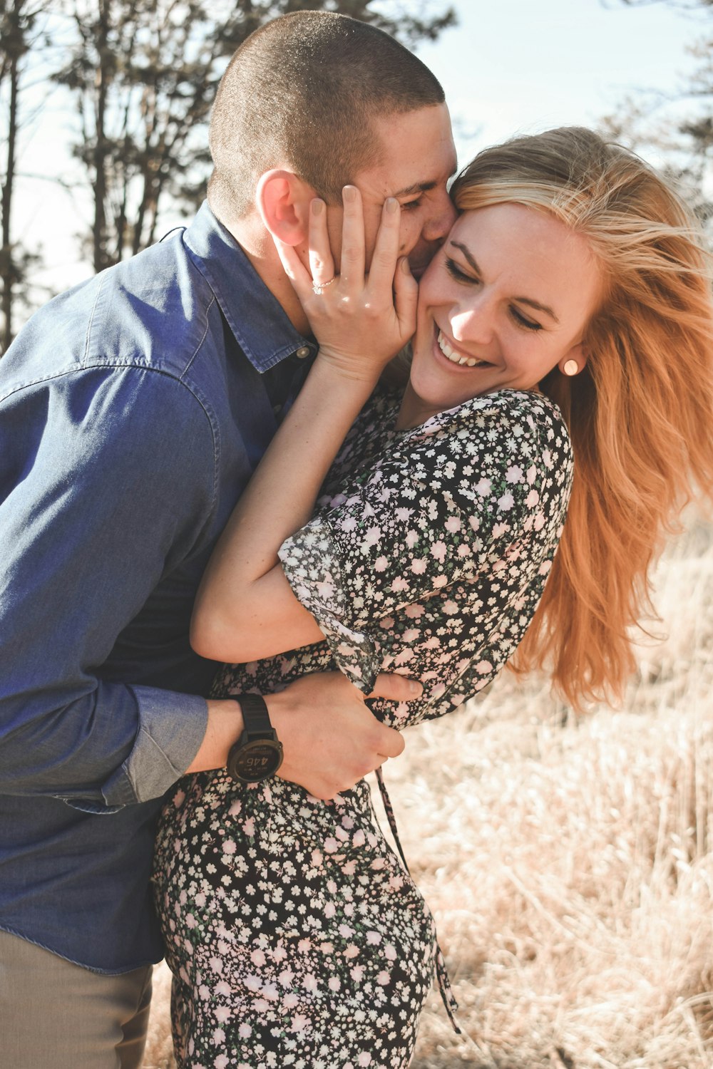 man and woman kissing each other