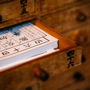 brown wooden framed white and black calendar