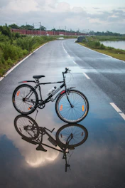 black mountain bike on road