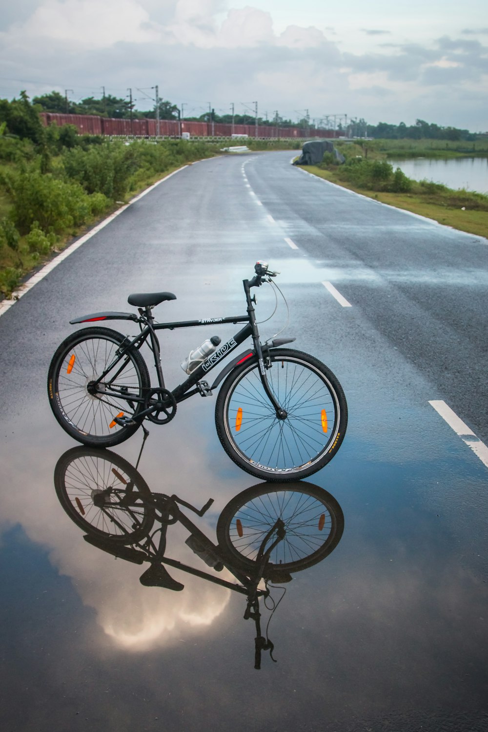 black mountain bike on road