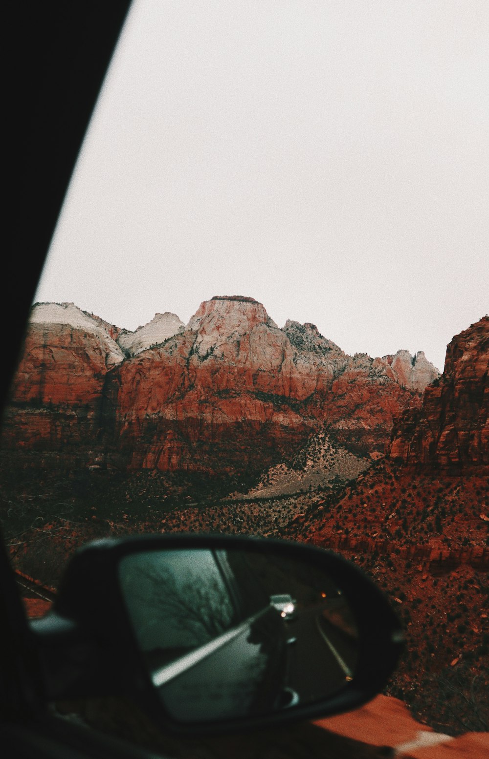 brown rocky mountain under white sky during daytime