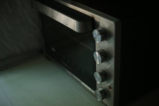 Close-up of a sparkling clean oven interior with polished surfaces.