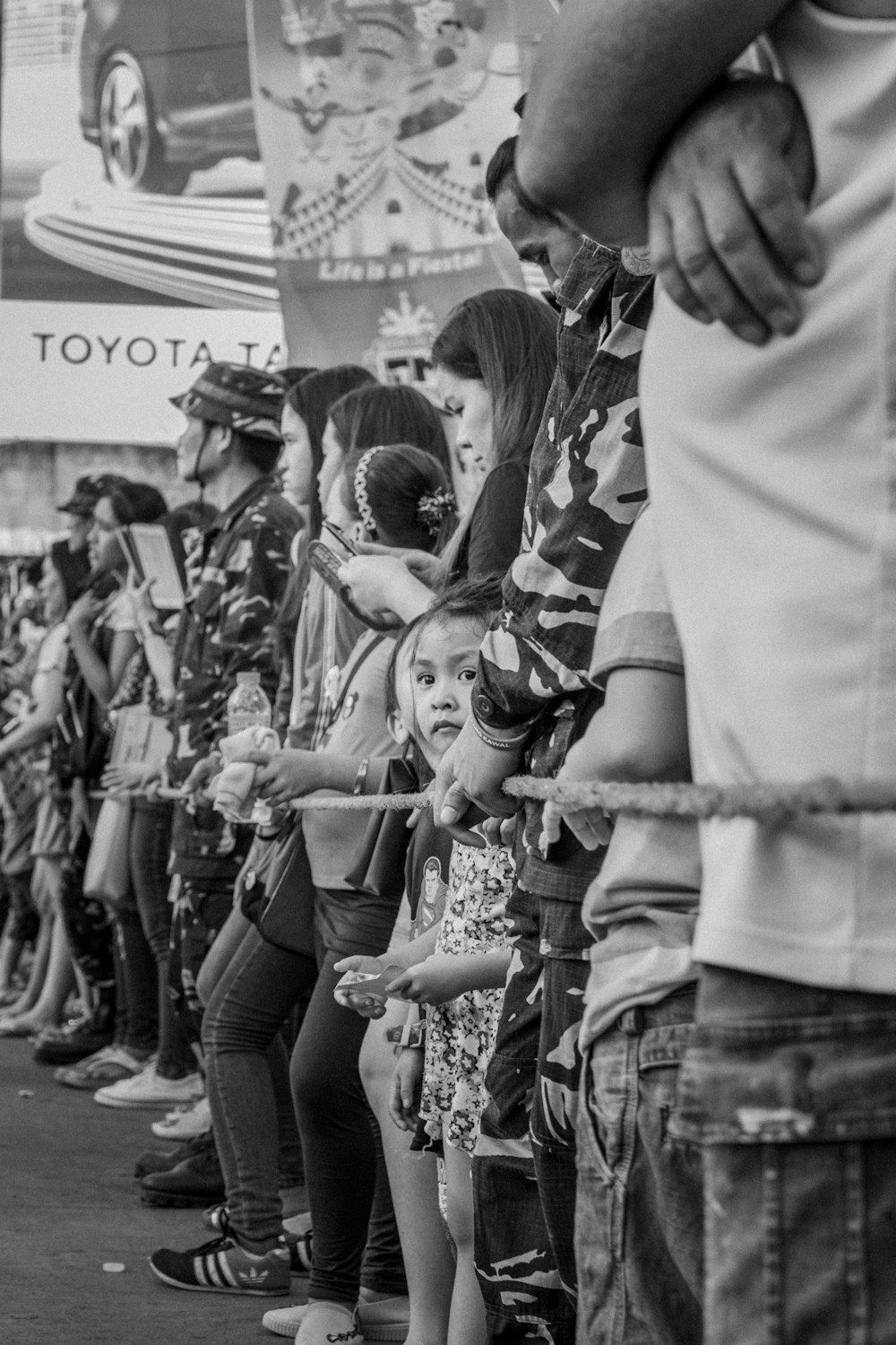 grayscale photo of people in a street